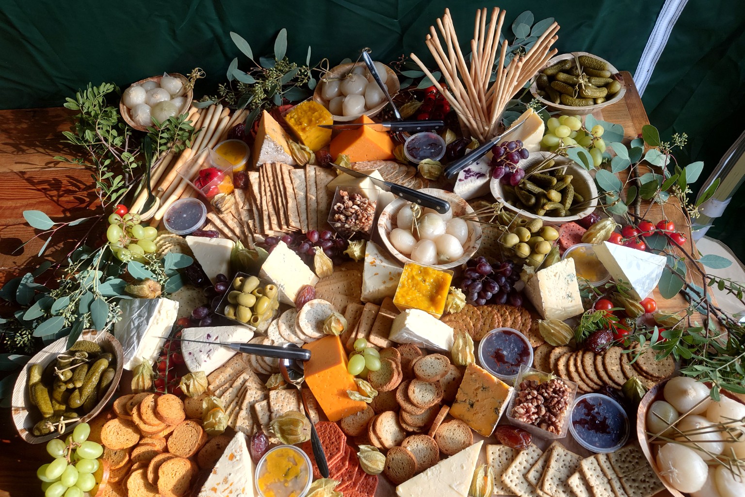 Franco’s generous grazing table with cheeses, crackers, grapes, olives, pickles and chutneys