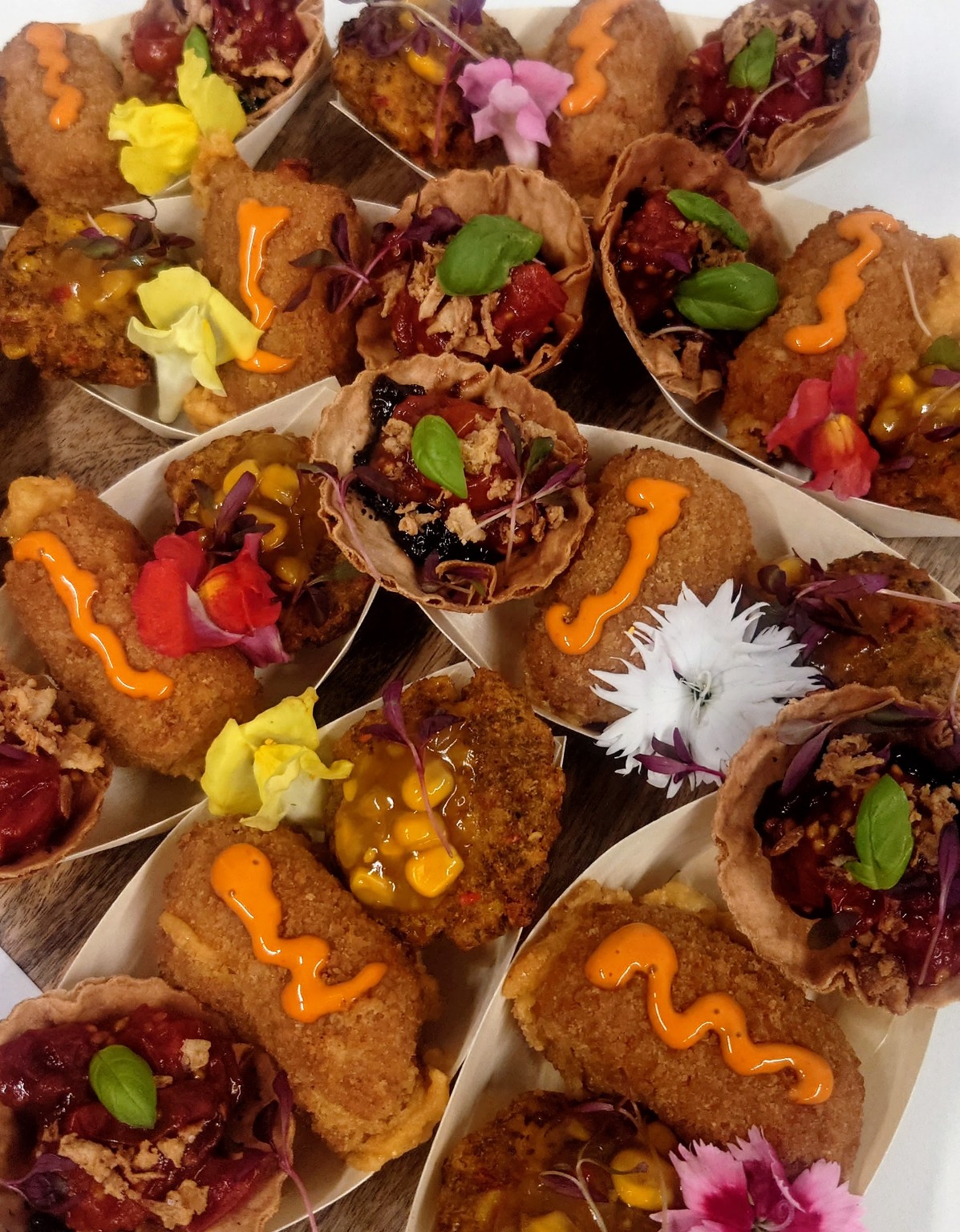 Small savoury platters with crisp bites, filled tartlets and colourful garnishes